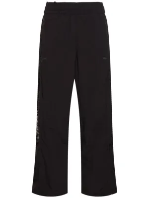 PUMA   Pleasures logo track pants 