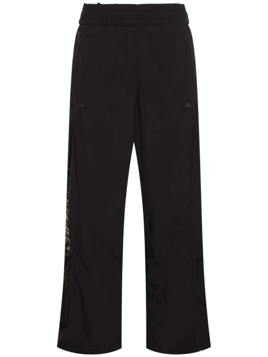 PUMA   Pleasures logo track pants 