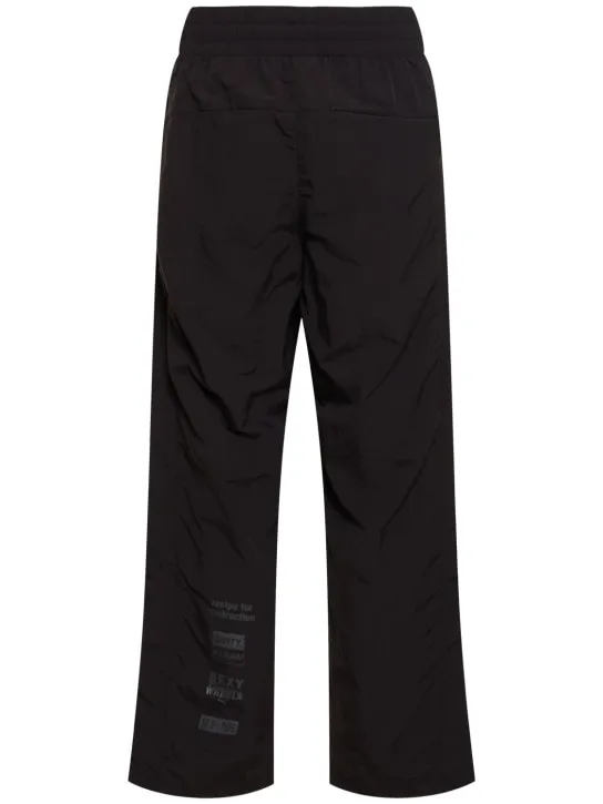 PUMA   Pleasures logo track pants 